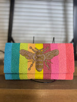 Hand Beaded Flap Clutch, Beautiful Bee Hand Embellished on a multi-color striped Beaded Pattern, Magnetic snap button closure, Lined Interiors, Detachable Chain Strap, Made in Cotton.